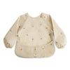 mushie Long Sleeve Baby Bib | Mess Free & Waterproof Fabric for Toddlers | Adjustable Fit for Ages 6-24 Months (Dinos)