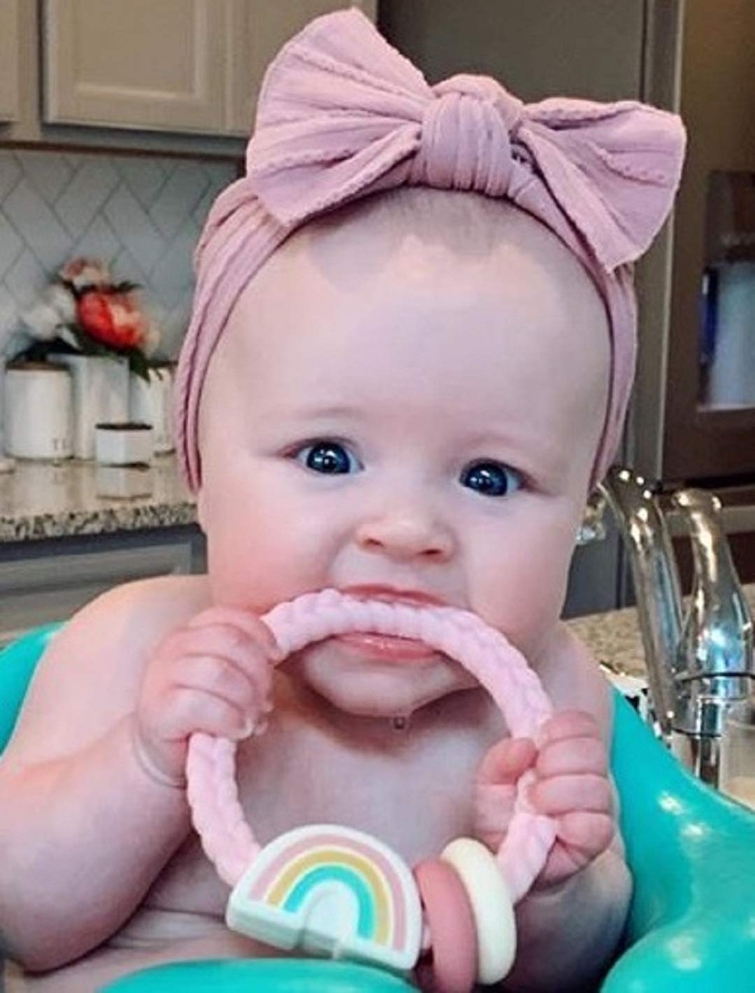 Itzy Ritzy Silicone Teether with Rattle; Rattle Teether Features Rattle Sound, Two Silicone Teething Rings and Raised Texture to