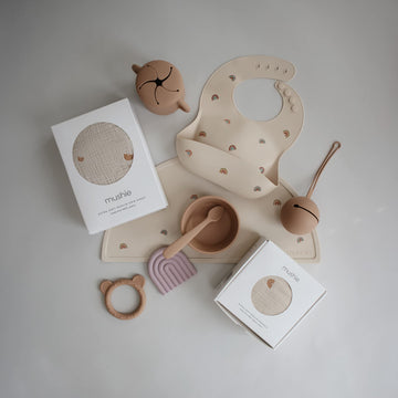 Mushie Silicone Baby Bib | Adjustable Fit Waterproof Bibs (Rainbows)