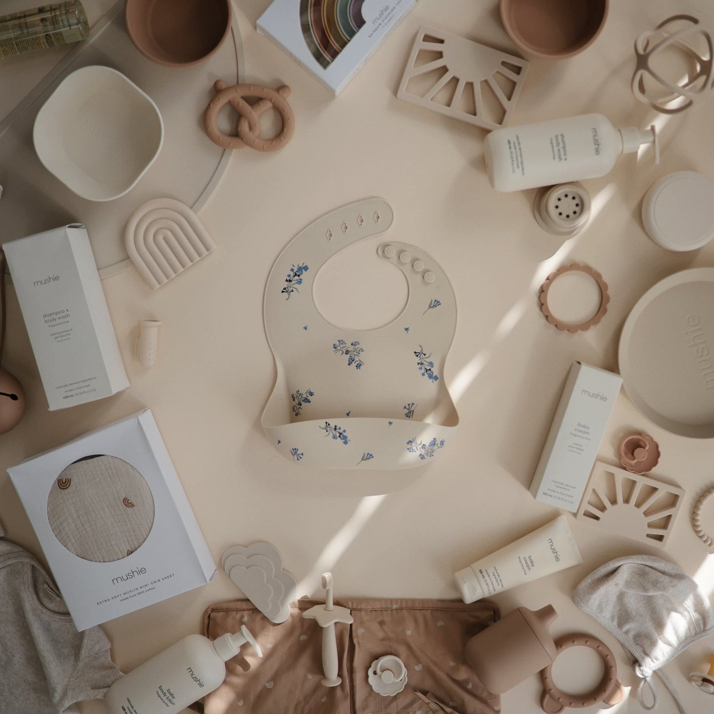 Mushie Silicone Baby Bib | Adjustable Fit Waterproof Bibs (Lilac Flowers)