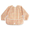 mushie Long Sleeve Baby Bib | Water Resistant Adjustable Fit for Ages 6-24 Months (Happy Flowers Check)