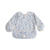 mushie Long Sleeve Baby Bib | Water Resistant Adjustable Fit for Ages 6-24 Months (Blue Flowers)