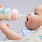 Tinukim Ifeed 9 Ounce Self Feeding Baby Bottle With Tube - Handless Anti-Colic Nursing System, Pink - 2-Pack