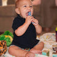 Brilliant Oral Care Babys First Toothbrush, Smooth Silicone Bristles Gently Clean Tender Teeth and Gums, for Ages 4+ Months, Pin