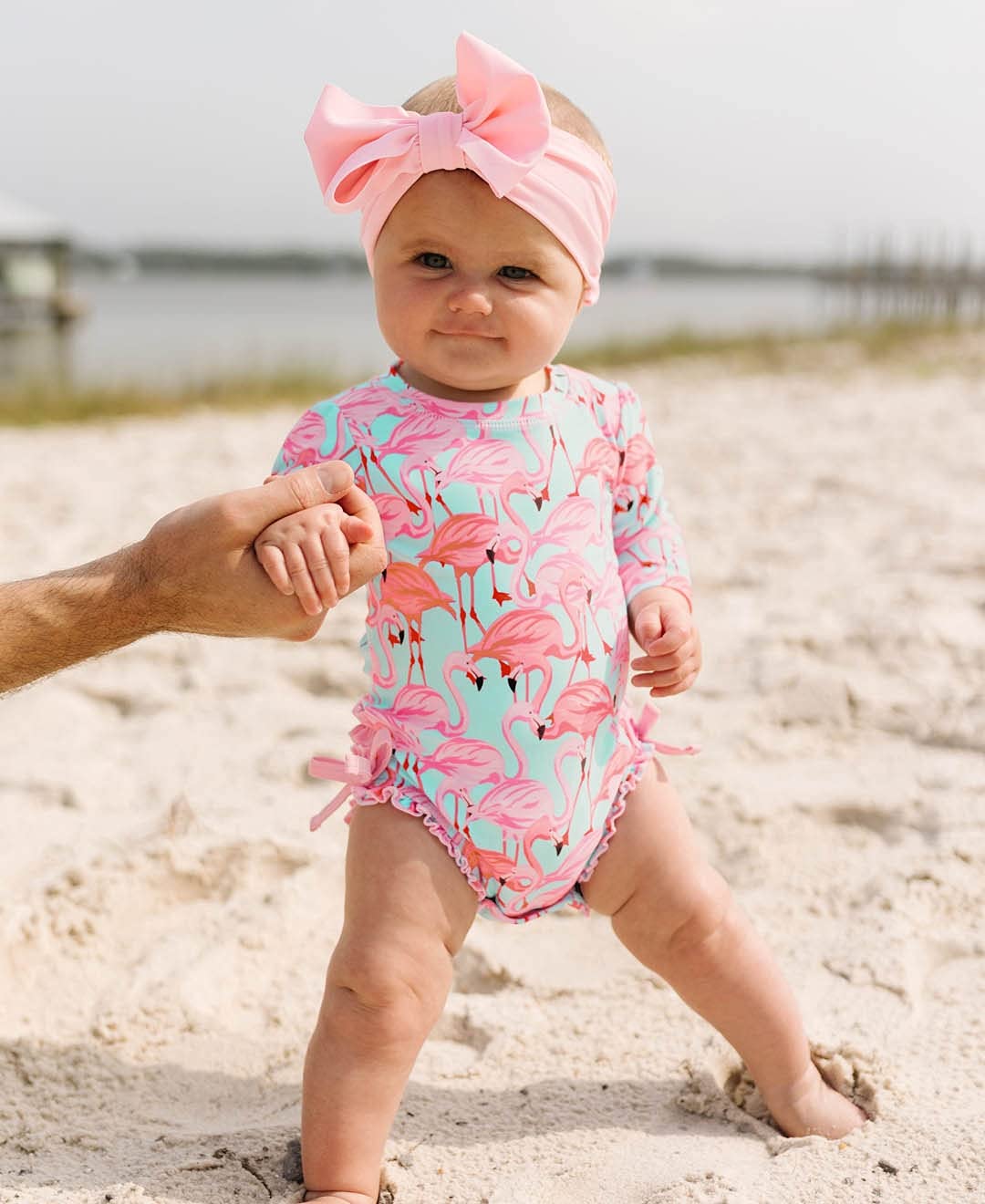 RuffleButts Baby Girls UPF 50+ Sun Protection Tropical Print Long Sleeve One Piece Rash Guard Swimsuit with Zipper - Fab Flaming