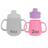 Nuby First Training Cup - Silicone Cup with Free-Flow Spout and Easy-Grip Design - 2 oz - 6+ Months - Purple and Pink