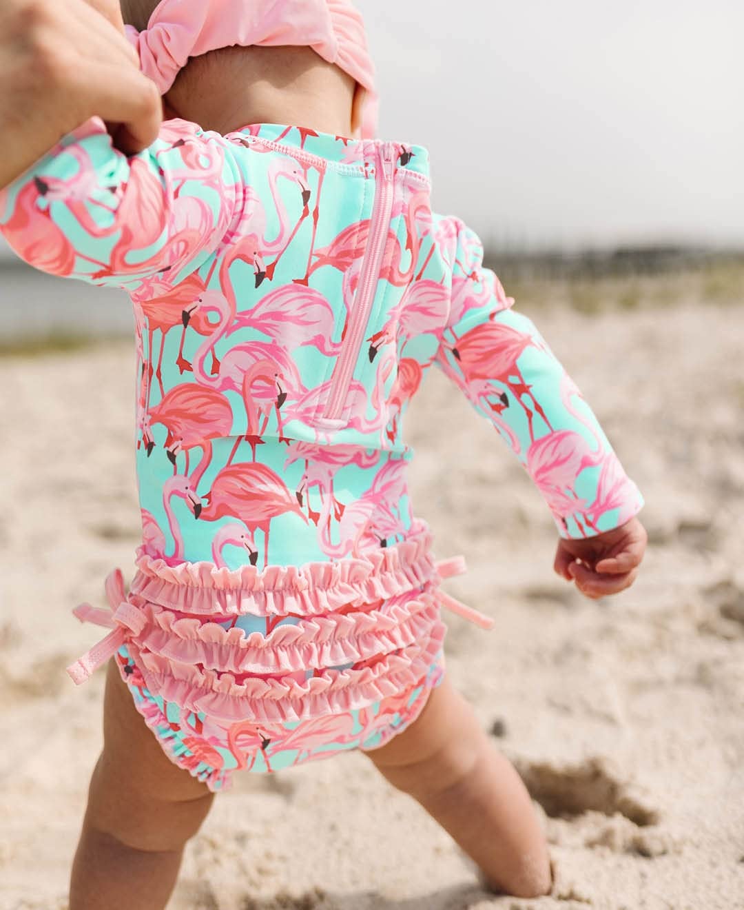 RuffleButts Baby Girls UPF 50+ Sun Protection Tropical Print Long Sleeve One Piece Rash Guard Swimsuit with Zipper - Fab Flaming