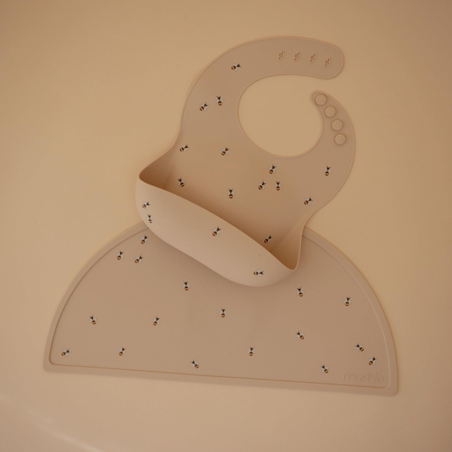 Mushie Silicone Baby Bib | Adjustable Fit Waterproof Bibs (Bees)