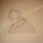 Mushie Silicone Baby Bib | Adjustable Fit Waterproof Bibs (Black Daisy)
