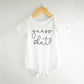 Bump And Beyond Designs Baby-Boys Surprise Pregnancy Announcement To Family Guess What Leotard White, 0-3 Months