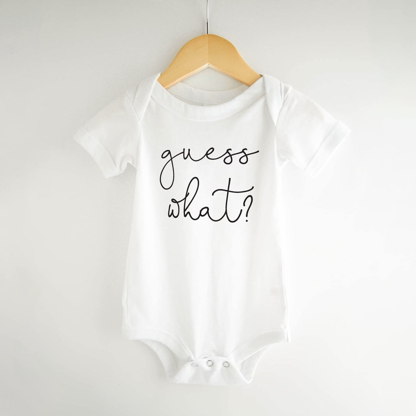 Bump And Beyond Designs Baby-Boys Surprise Pregnancy Announcement To Family Guess What Leotard White, 0-3 Months