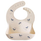 Mushie Silicone Baby Bib | Adjustable Fit Waterproof Bibs (Whales)