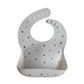 Mushie Silicone Baby Bib | Adjustable Fit Waterproof Bibs (Letters White)
