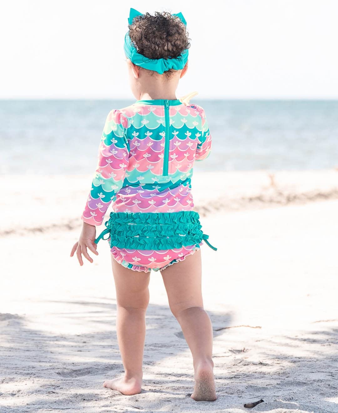 RuffleButts Baby Girls UPF 50+ Sun Protection Novelty Print Long Sleeve One Piece Rash Guard Swimsuit with Zipper - Mermaid/Aqua