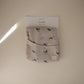 mushie Long Sleeve Baby Bib | Mess Free & Waterproof Fabric for Toddlers | Adjustable Fit for Ages 6-24 Months (Whales)