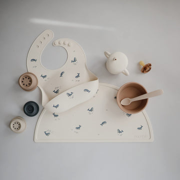 Mushie Silicone Baby Bib | Adjustable Fit Waterproof Bibs (Whales)