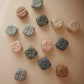 mushie Silicone Dice Press Toy | Baby Sensory Play for 10+ Months (Tradewinds/Stone)