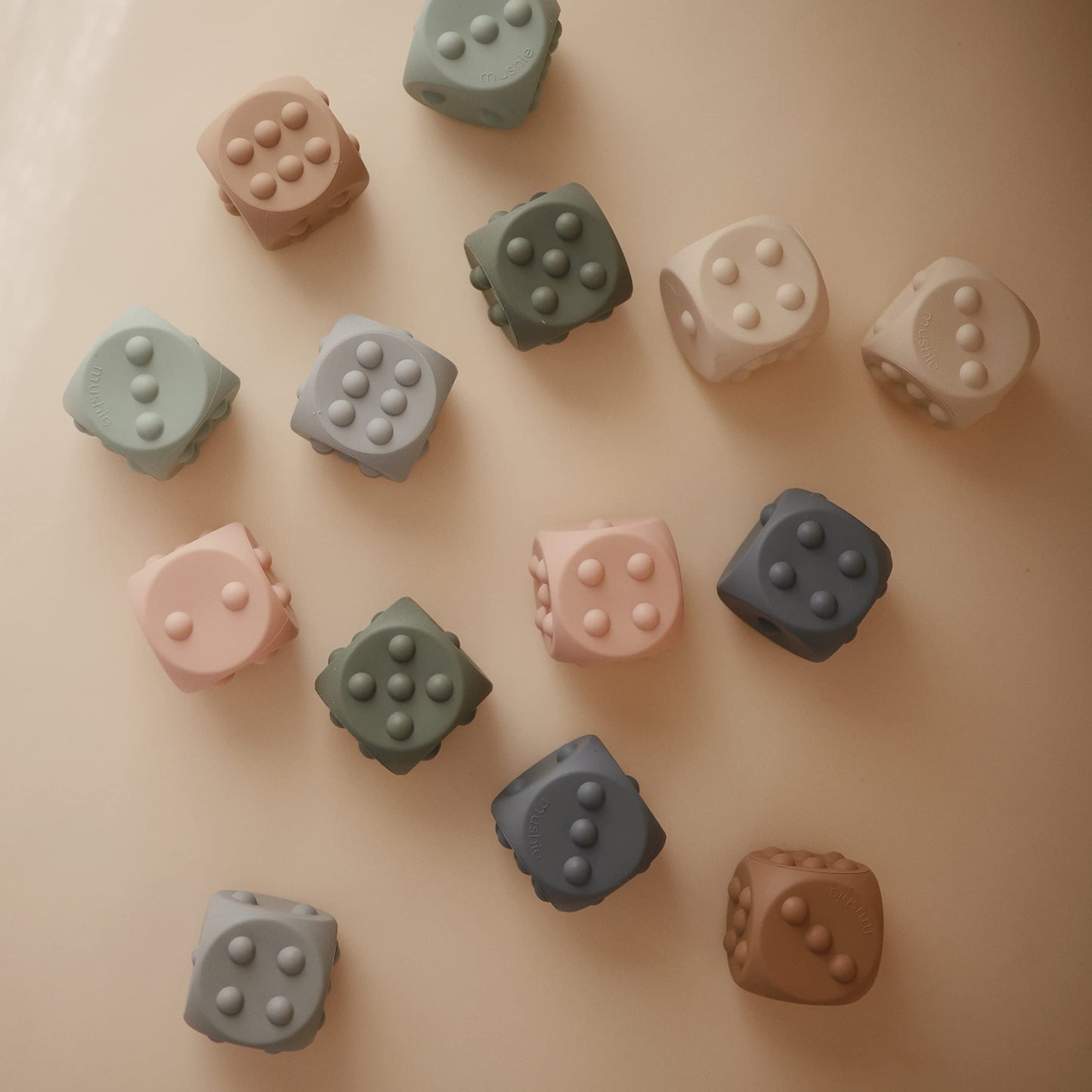 mushie Silicone Dice Press Toy | Baby Sensory Play for 10+ Months (Tradewinds/Stone)