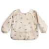 mushie Long Sleeve Baby Bib | Mess Free & Waterproof Fabric for Toddlers | Adjustable Fit for Ages 6-24 Months (Whales)