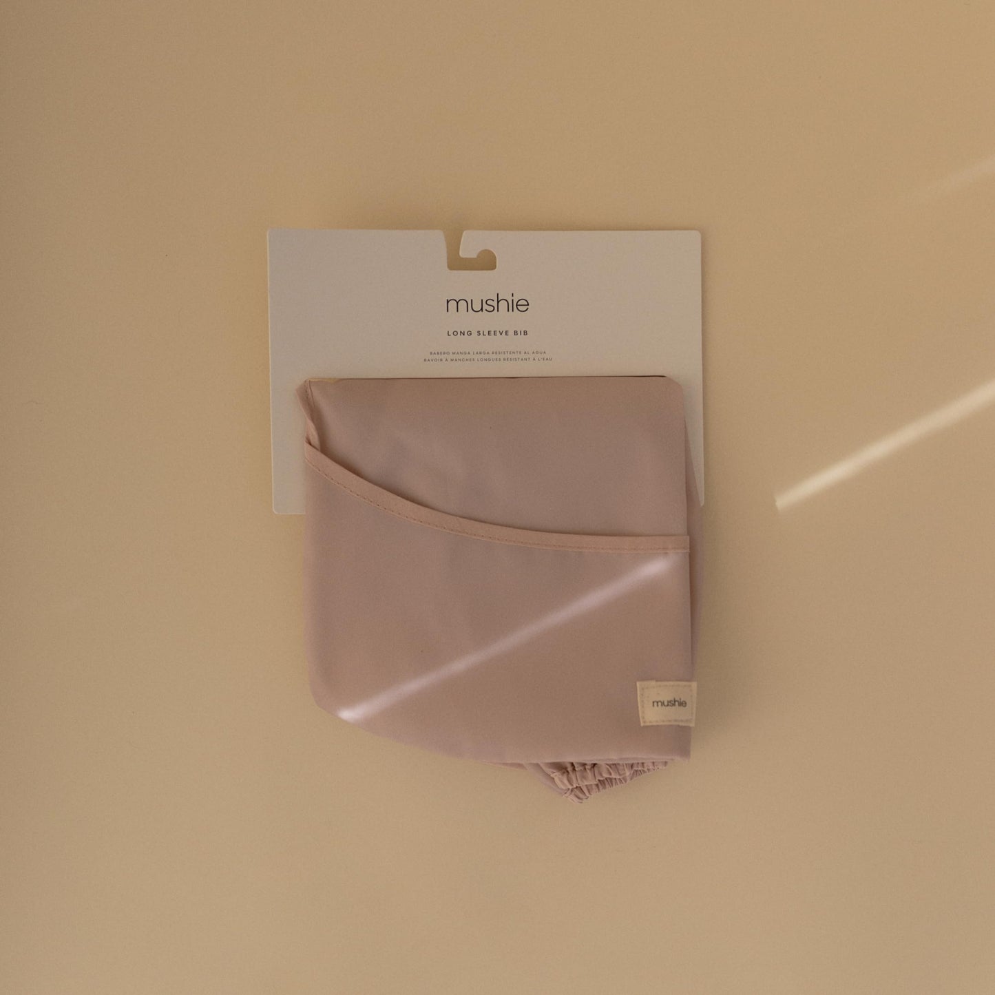 mushie Long Sleeve Baby Bib | Mess Free & Waterproof Fabric for Toddlers | Adjustable Fit for Ages 6-24 Months (Blush)