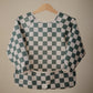 mushie Long Sleeve Baby Bib | Mess Free & Waterproof Fabric for Toddlers | Adjustable Fit for Ages 6-24 Months (Olive Check)
