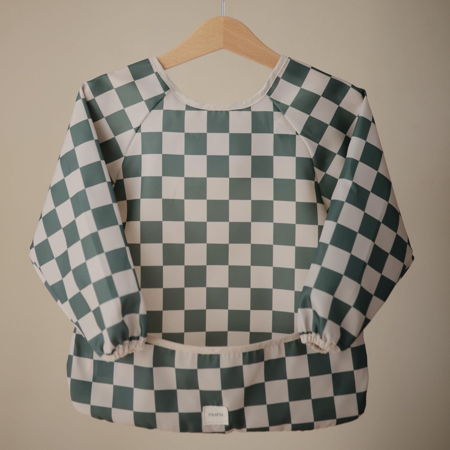 mushie Long Sleeve Baby Bib | Mess Free & Waterproof Fabric for Toddlers | Adjustable Fit for Ages 6-24 Months (Olive Check)