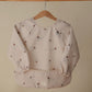 mushie Long Sleeve Baby Bib | Mess Free & Waterproof Fabric for Toddlers | Adjustable Fit for Ages 6-24 Months (Boats)