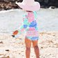 RuffleButts Baby Girls UPF 50+ Sun Protection Floral Printed Long Sleeve One Piece Rash Guard Swimsuit with Zipper - Pastel Peta