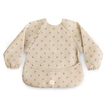 mushie Long Sleeve Baby Bib | Water Resistant Adjustable Fit for Ages 6-24 Months (Cherries)