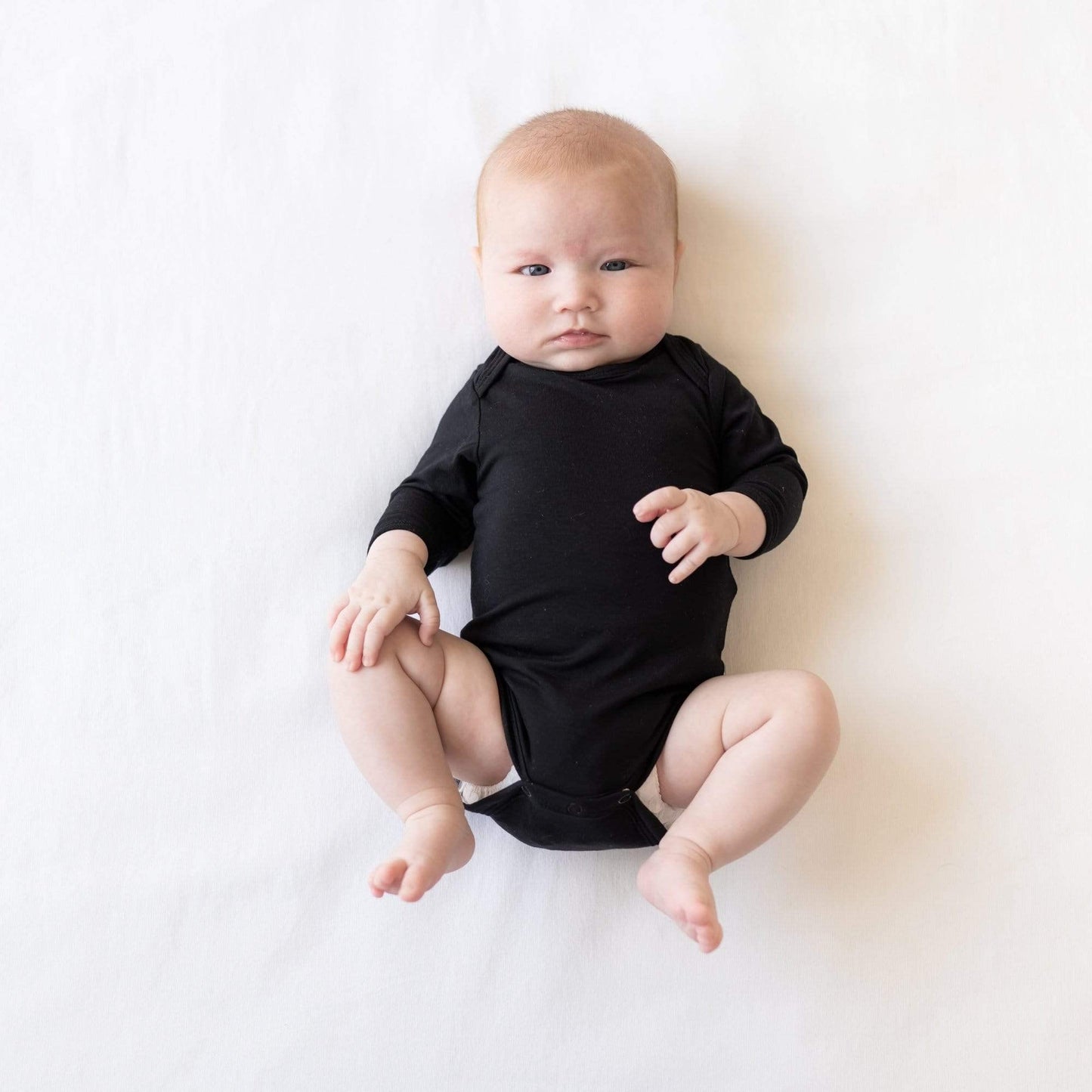 Kyte Baby Unisex Long Sleeve Bodysuit, Rayon Made From Bamboo (3-6 Months, Midnight)