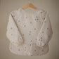 mushie Long Sleeve Baby Bib | Mess Free & Waterproof Fabric for Toddlers | Adjustable Fit for Ages 6-24 Months (Bees)