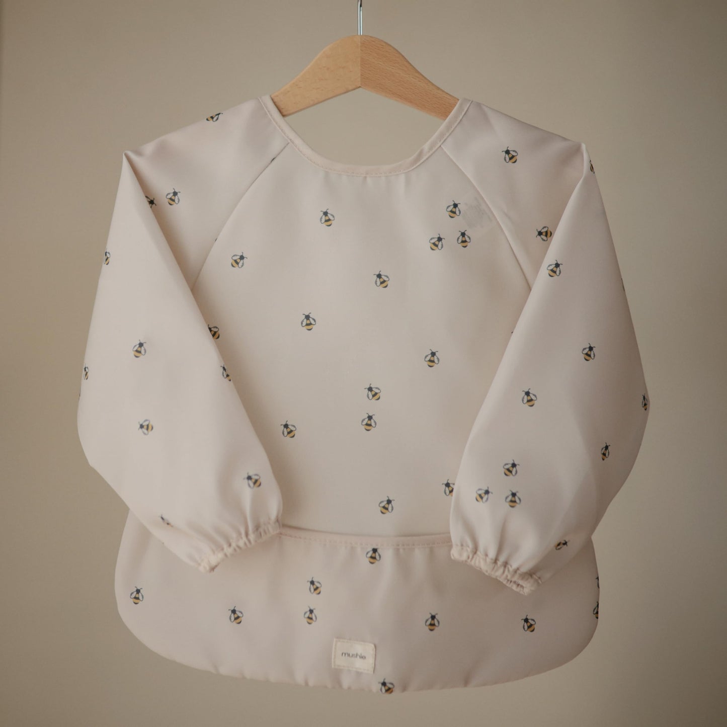 mushie Long Sleeve Baby Bib | Mess Free & Waterproof Fabric for Toddlers | Adjustable Fit for Ages 6-24 Months (Bees)