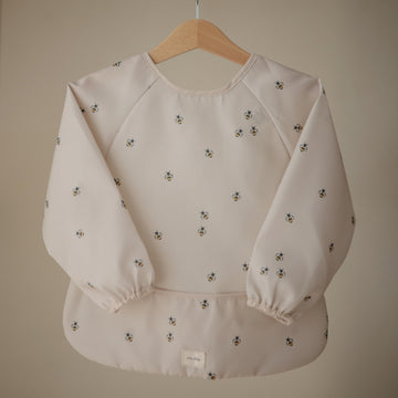 mushie Long Sleeve Baby Bib | Mess Free & Waterproof Fabric for Toddlers | Adjustable Fit for Ages 6-24 Months (Bees)