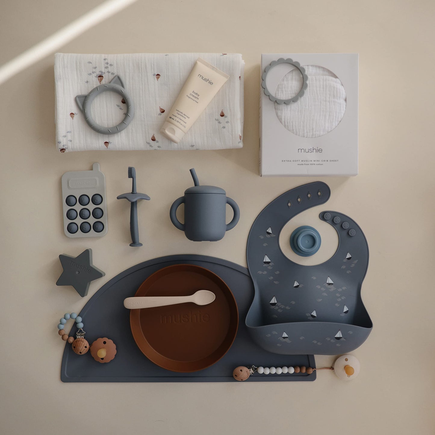 Mushie Silicone Baby Bib | Adjustable Fit Waterproof Bibs (Boats)