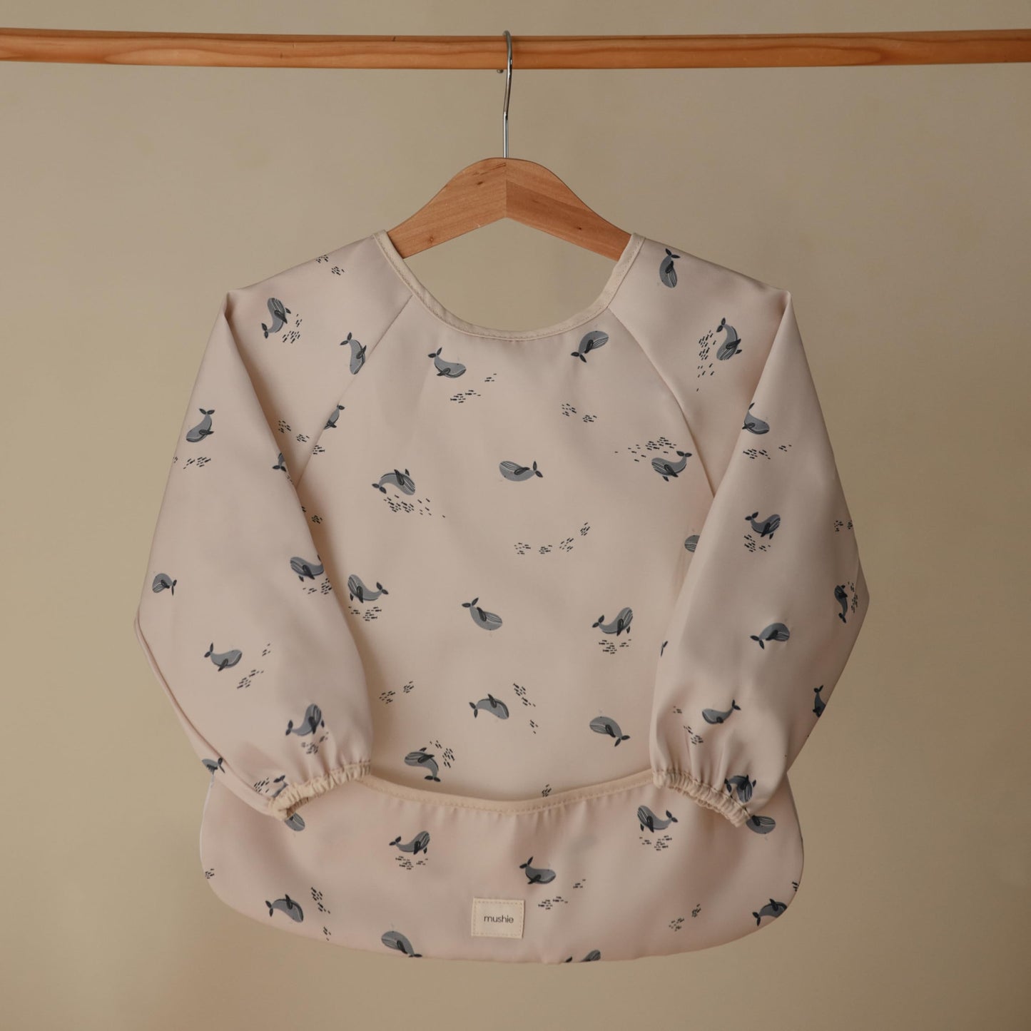 mushie Long Sleeve Baby Bib | Mess Free & Waterproof Fabric for Toddlers | Adjustable Fit for Ages 6-24 Months (Whales)