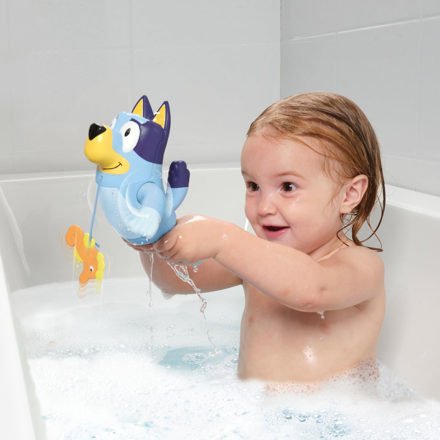 Toomies Bluey Swimming Bath Toy - Bluey Toys Includes Attached Seahorse Baby Toy and Swims on Back or Front - Toddler Bath Toys