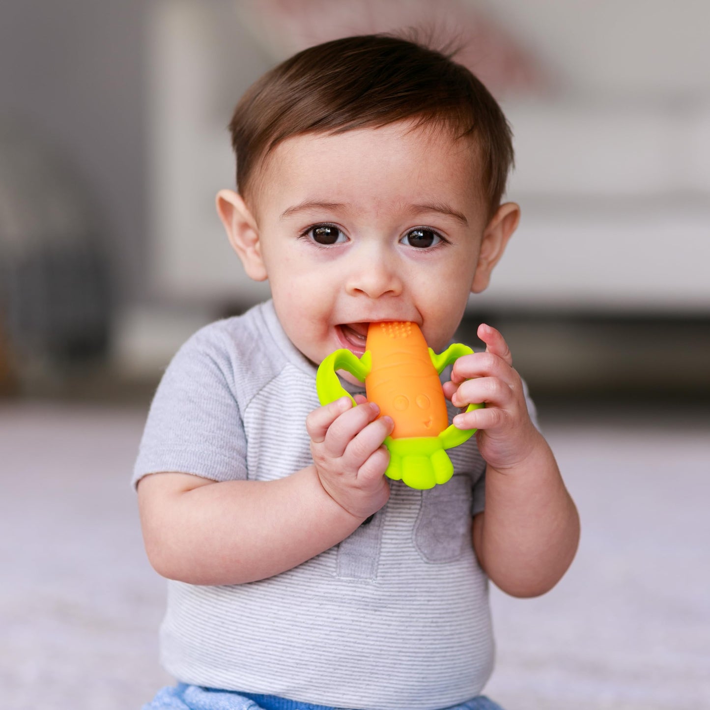 Infantino Lil Nibbles Textured Silicone Baby Teether - Sensory Exploration and Teething Relief with Easy to Hold Handles, Orang
