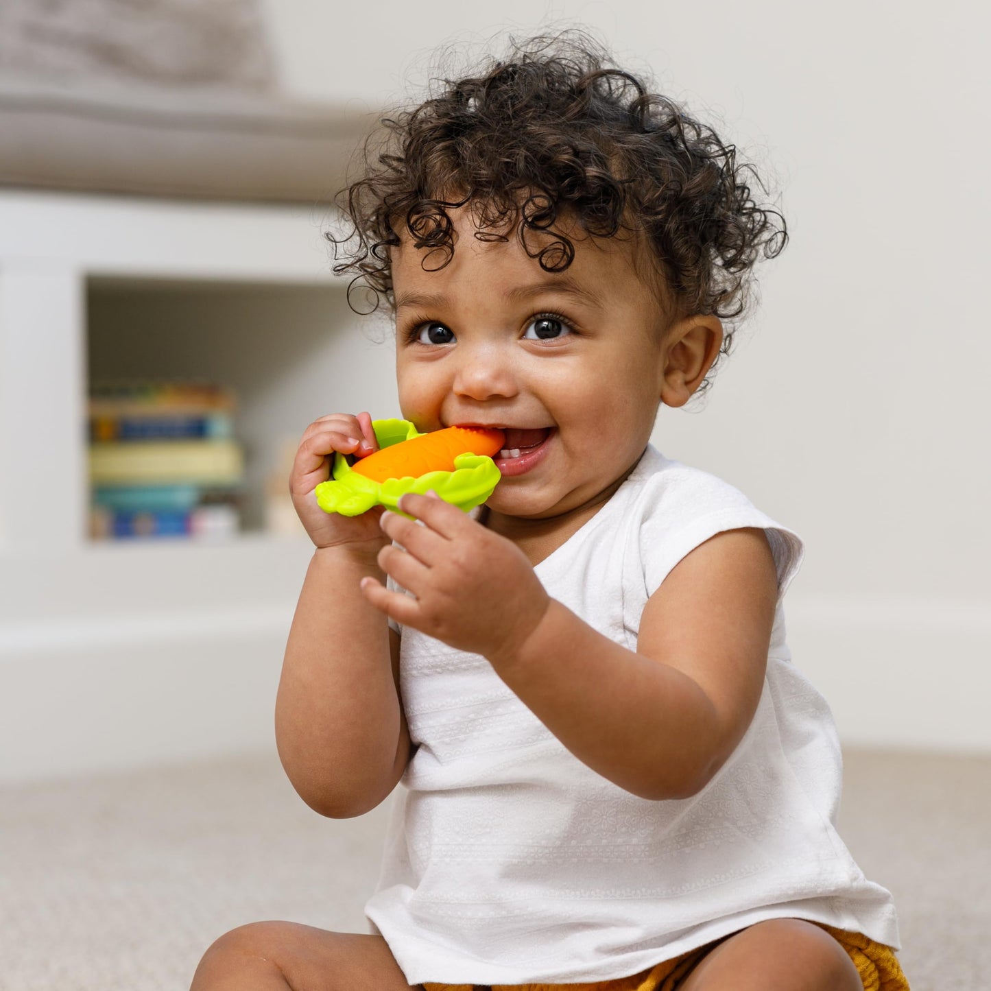 Infantino Lil Nibbles Textured Silicone Baby Teether - Sensory Exploration and Teething Relief with Easy to Hold Handles, Orang