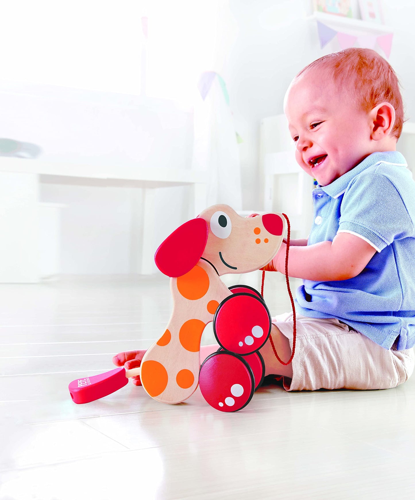 Walk-A-Long Puppy Wooden Pull Toy by Hape  Award Winning Push Pull Toy Puppy For Toddlers Can Sit, Stand and Roll. Rubber Rimmed