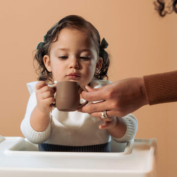 Bravejusticekidsco. | Teenie Tiny Silicone Developmental Baby-Led Weaning Drinking Cups (2 Pack) (Warm Taupe)