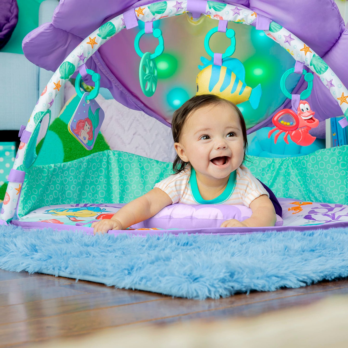 Bright Starts Disney Baby The Little Mermaid Twinkle Trove Light-Up Musical Baby Activity Gym with Tummy Time Pillow, Newborn+