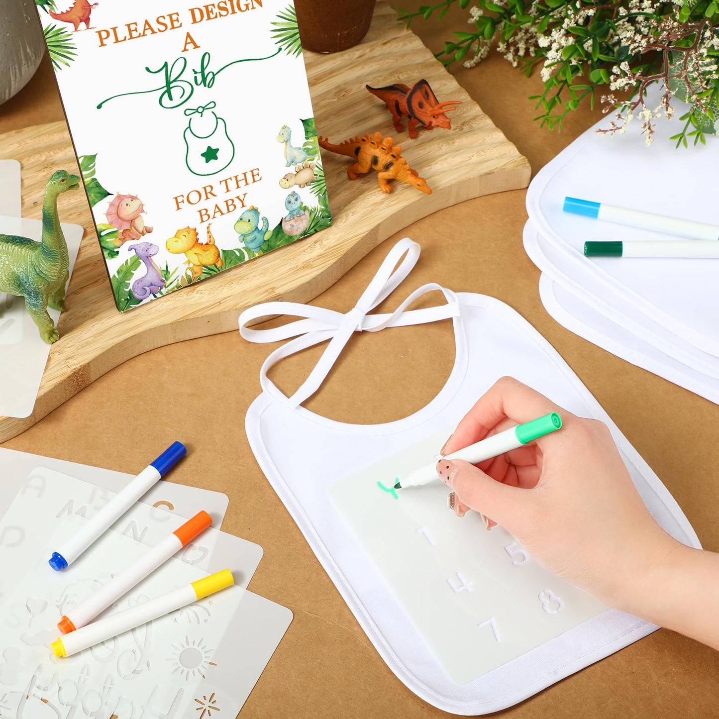 Panitay 100 Pcs Diy Baby Bibs Decorating Kit 50 White Bibs 25 Stencils 24 Fabric Markers 1 Baby Shower Game Sign(Dinosaur)