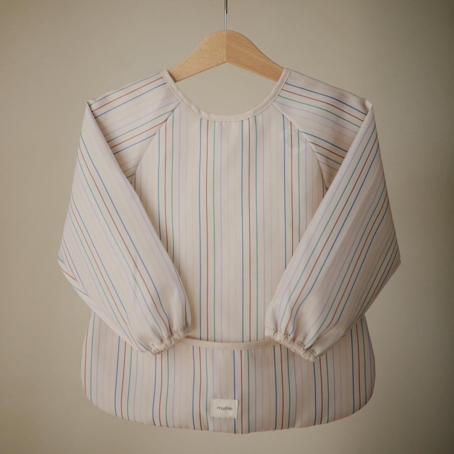 mushie Long Sleeve Baby Bib | Mess Free & Waterproof Fabric for Toddlers | Adjustable Fit for Ages 6-24 Months (Retro Stripes)