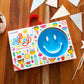 Munchkin Be Happy Toddler Feeding Supplies Gift Set, Includes Happy Face Suction Plate, Straw Cup And Utensil Set, Blue