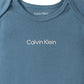 Calvin Klein Organic Baby Boys Essentials 4-Piece Set With Long Sleeve Tee & Pants, Ultra-Soft Beanie & Socks Included, Coronet